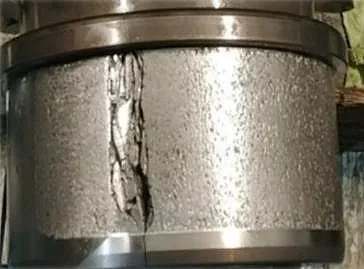 Wear debris from a wind turbine gearbox bearing detected by a fluid condition sensor